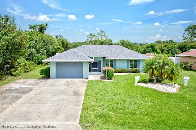 ranch-style home featuring driveway, a garage, a front lawn, and stucco siding