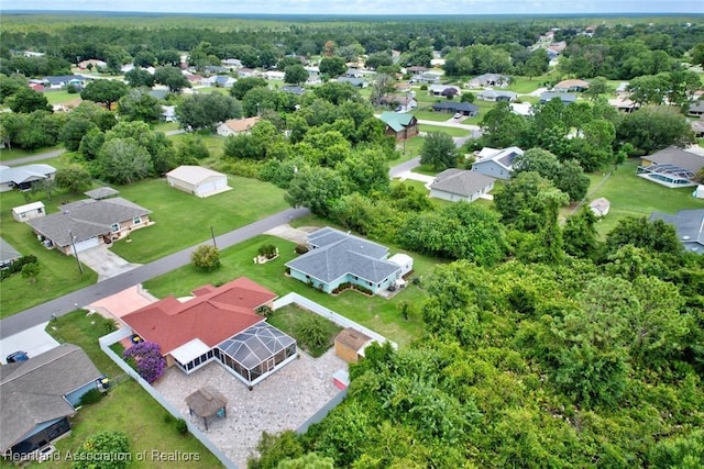 birds eye view of property with a residential view