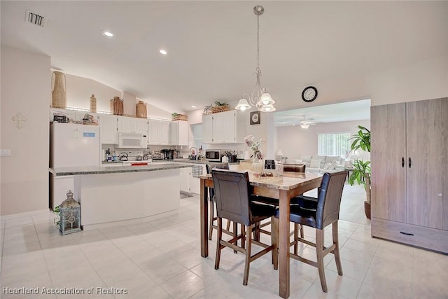 dining space featuring lofted ceiling, ceiling fan, visible vents, and recessed lighting