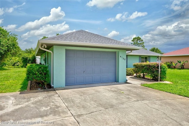 exterior space featuring stucco siding, roof with shingles, concrete driveway, and a front yard