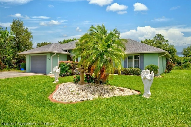 ranch-style home with a garage, driveway, roof with shingles, a front lawn, and stucco siding