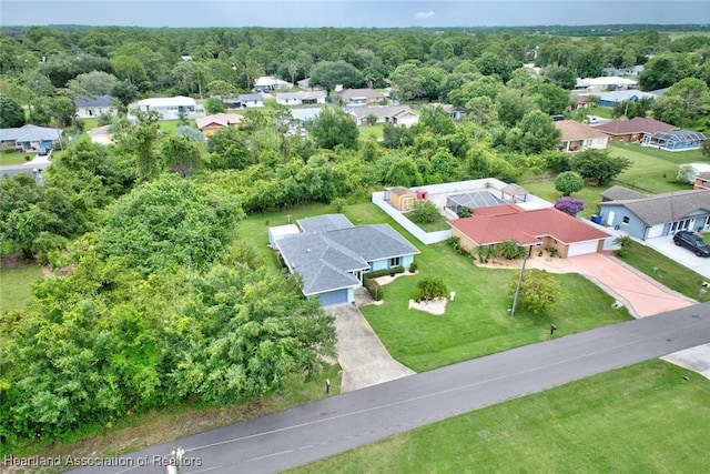 aerial view featuring a residential view and a view of trees