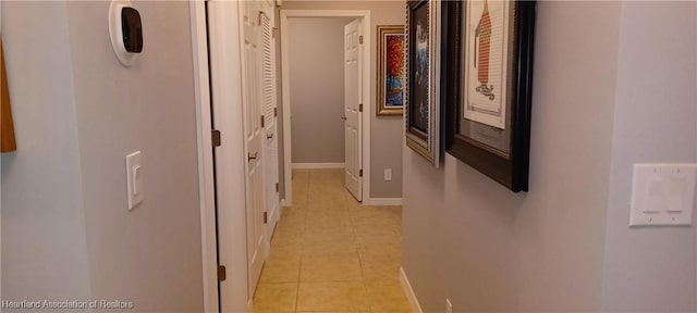 corridor featuring light tile patterned floors