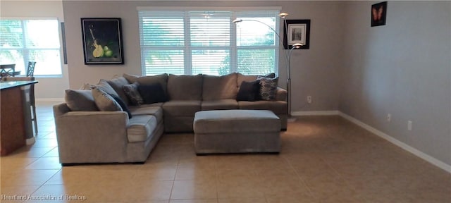 living room with light tile patterned flooring