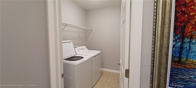 washroom featuring independent washer and dryer and light tile patterned floors