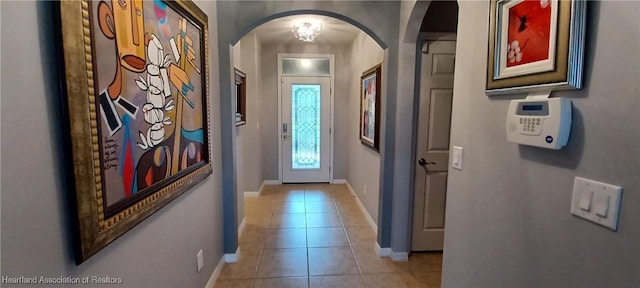 entryway with light tile patterned floors