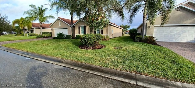 ranch-style home with a garage and a front yard