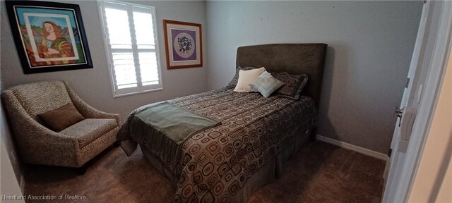 bedroom with dark carpet