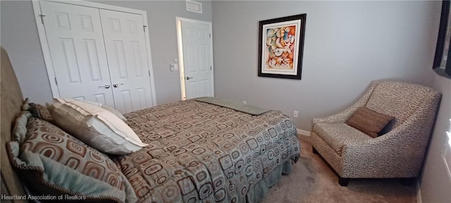 carpeted bedroom with a closet