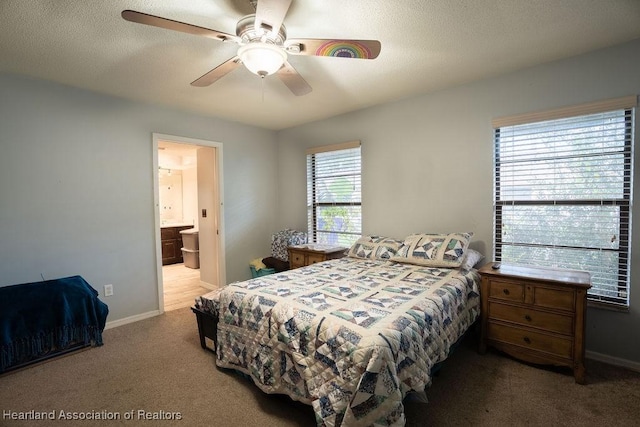 bedroom with carpet, ensuite bathroom, and ceiling fan