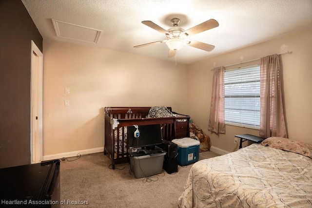 bedroom with carpet, a textured ceiling, and ceiling fan