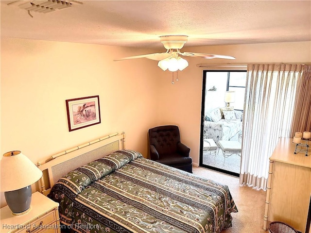 4620 Lafayette Ave, Sebring, FL 33875 - bedroom with access to outside, a textured ceiling, visible vents, ceiling fan, and light colored carpet