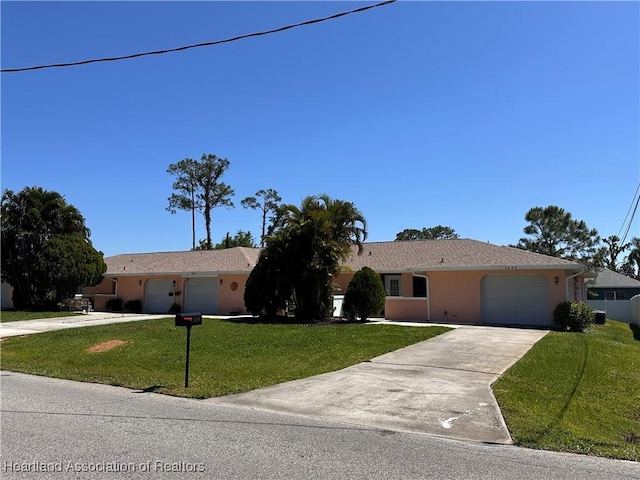 4620 Lafayette Ave, Sebring, FL 33875 - ranch-style house featuring driveway, stucco siding, a garage, and a front lawn