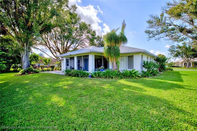 view of front of home with a front lawn