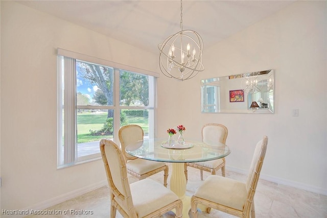 dining area with an inviting chandelier