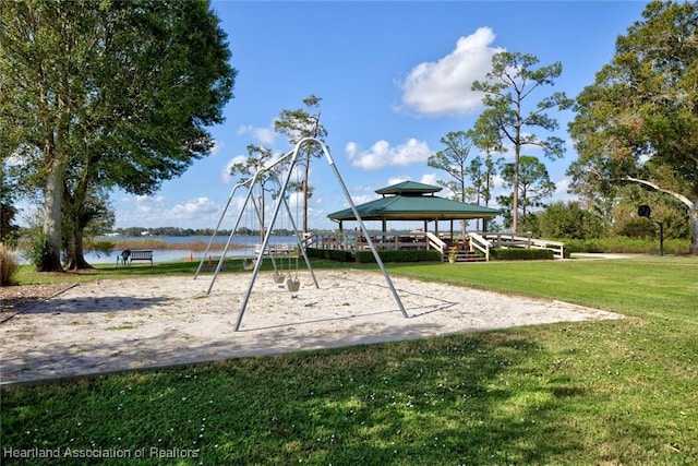 view of play area with a gazebo, a water view, and a lawn