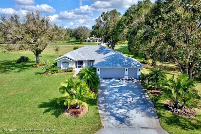 single story home with a garage and a front lawn