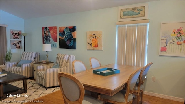 dining area with light hardwood / wood-style floors