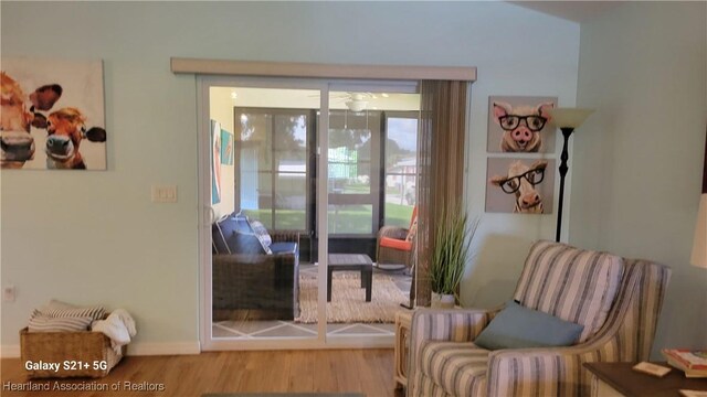 sitting room with hardwood / wood-style floors