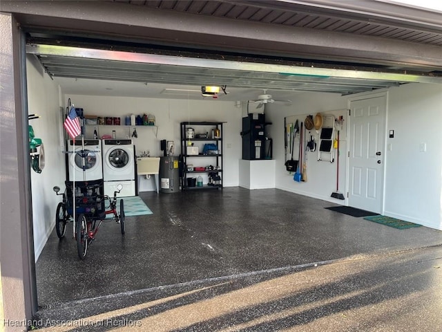 garage with washer and dryer, sink, a garage door opener, and water heater