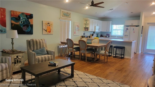 interior space featuring light hardwood / wood-style floors and ceiling fan