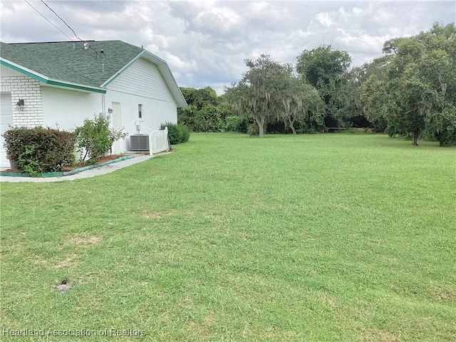 view of yard featuring central AC