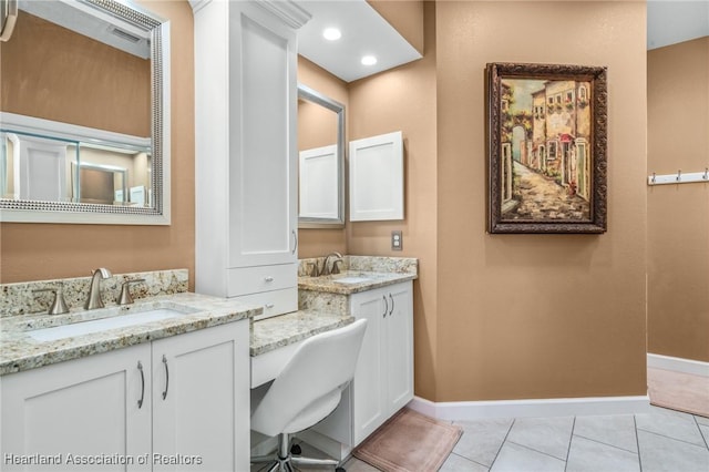 bathroom featuring tile patterned flooring and vanity