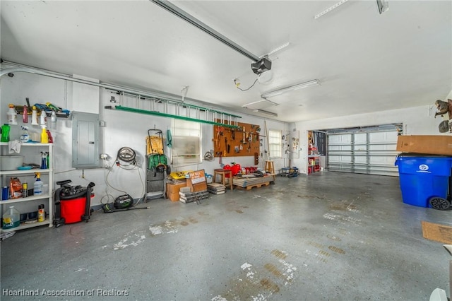 garage featuring electric panel and a garage door opener