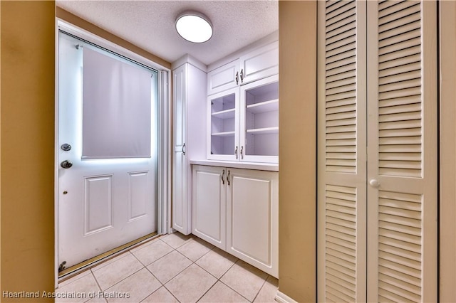 2131 Lakeview Dr Unit 508, Sebring, FL 33870 - doorway with light tile patterned flooring and a textured ceiling