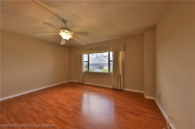 2131 Lakeview Dr Unit 508, Sebring, FL 33870 - unfurnished room featuring a textured ceiling, wood finished floors, and a ceiling fan