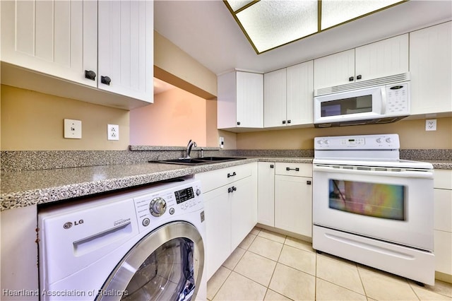 2131 Lakeview Dr Unit 508, Sebring, FL 33870 - kitchen with white appliances, washer / clothes dryer, white cabinetry, and light tile patterned floors