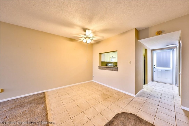 2131 Lakeview Dr Unit 508, Sebring, FL 33870 - spare room featuring a ceiling fan, light tile patterned floors, and a textured ceiling