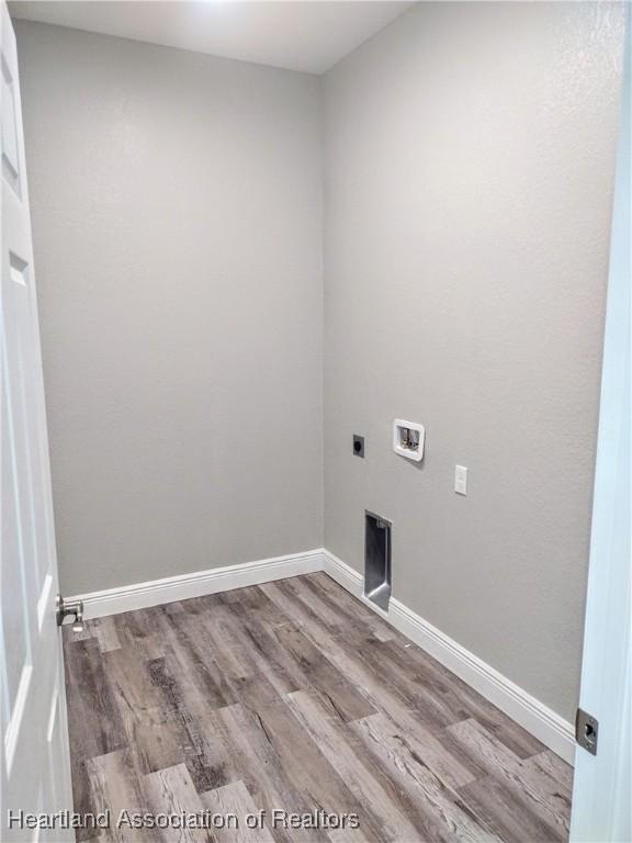 laundry room featuring hookup for an electric dryer, washer hookup, and wood-type flooring