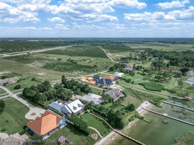 drone / aerial view with a water view and a rural view