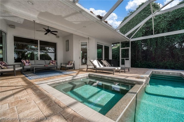 view of pool featuring an outdoor hangout area, ceiling fan, a patio area, and a lanai