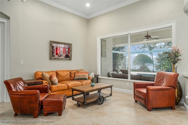 living room featuring ceiling fan and crown molding