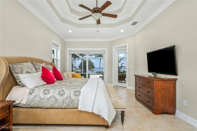 bedroom featuring ceiling fan, access to exterior, crown molding, and a tray ceiling