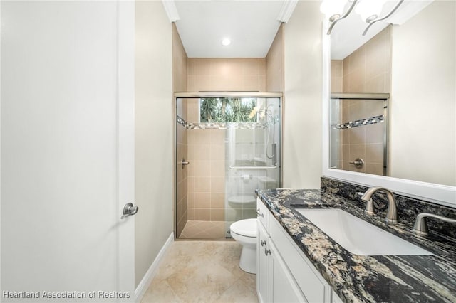 bathroom featuring toilet, an enclosed shower, and vanity