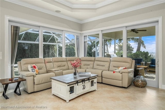 sunroom featuring ceiling fan and a tray ceiling