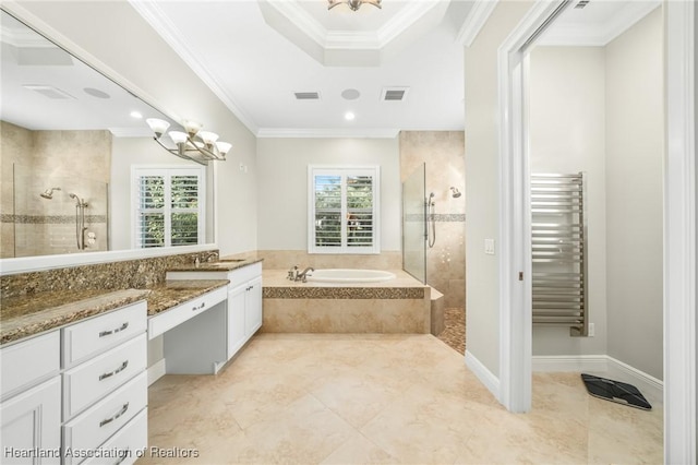 bathroom featuring radiator heating unit, vanity, an inviting chandelier, crown molding, and separate shower and tub