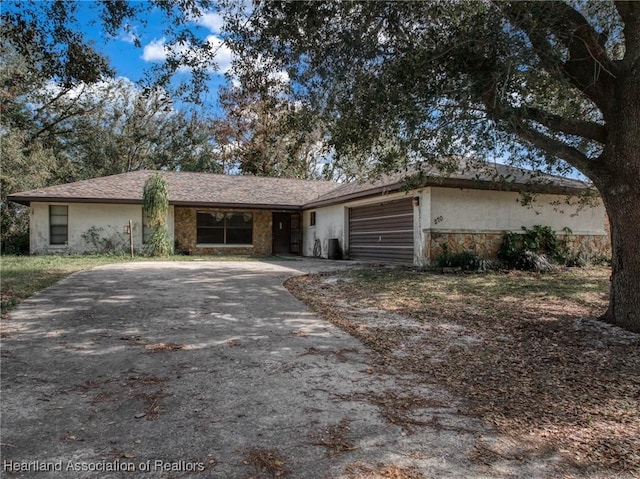 ranch-style house featuring a garage