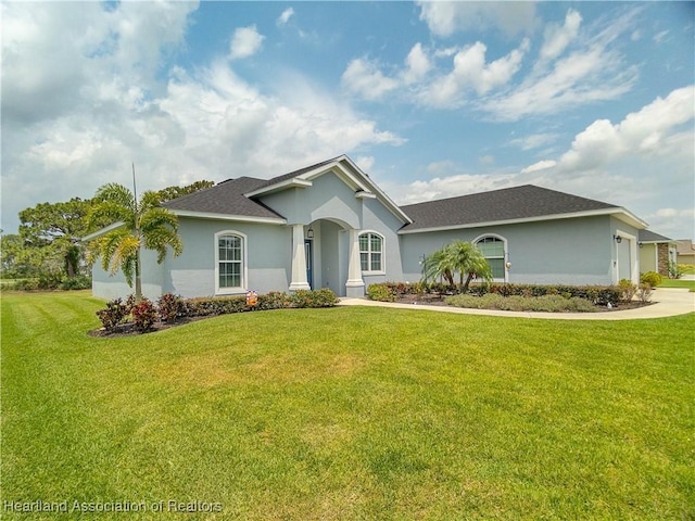 4936 Myrtle Dr, Sebring, FL 33872 - single story home featuring stucco siding, a front lawn, and a garage