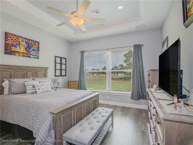 4936 Myrtle Dr, Sebring, FL 33872 - bedroom with a raised ceiling, wood finished floors, recessed lighting, and a ceiling fan