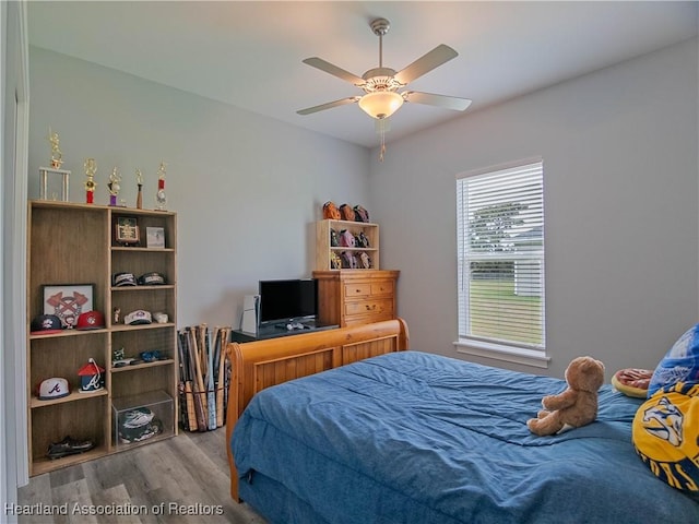 4936 Myrtle Dr, Sebring, FL 33872 - bedroom with wood finished floors and ceiling fan