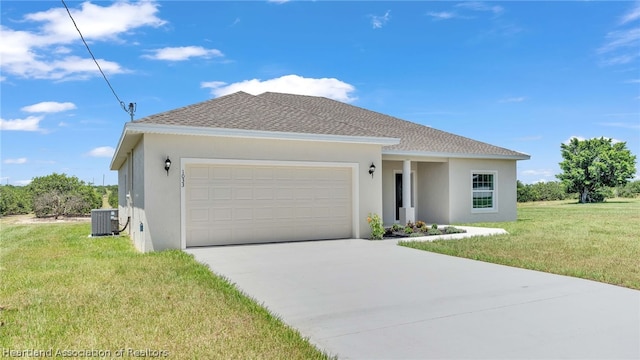 view of front of house with a front lawn, a garage, and central AC unit