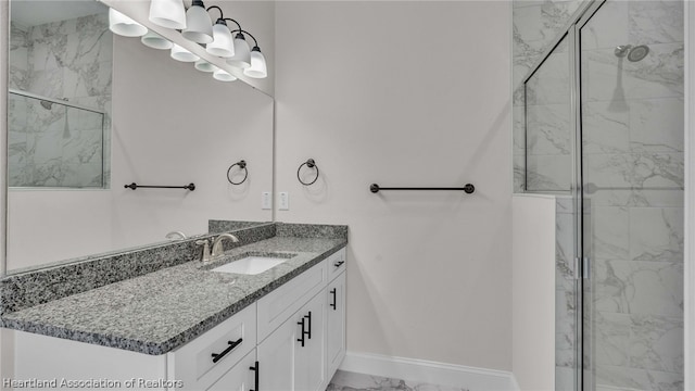 bathroom with vanity and a shower with shower door