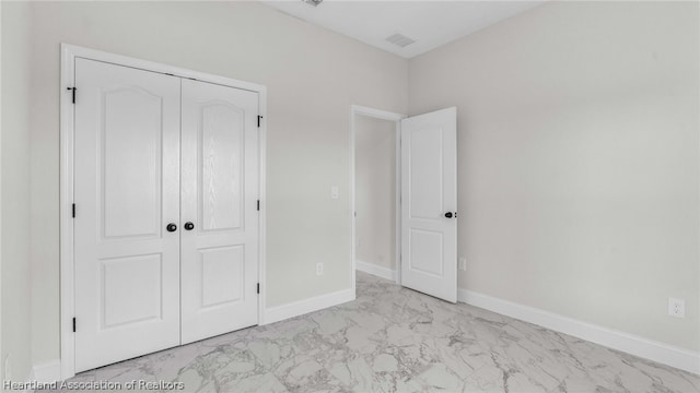 unfurnished bedroom with a closet