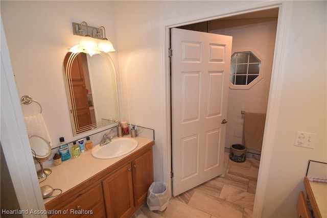 bathroom with tile patterned flooring and vanity