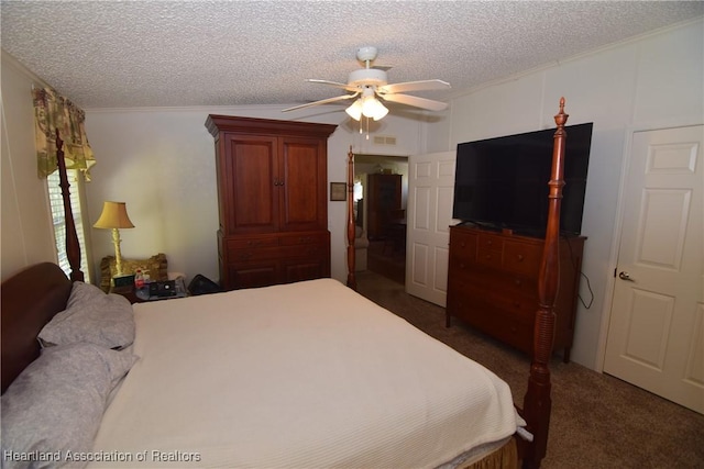 bedroom with ceiling fan, crown molding, dark carpet, and a textured ceiling