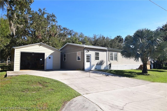 view of front of house with a garage and a front yard